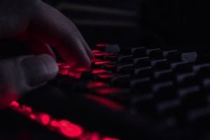 a close up of a person's hand on a keyboard