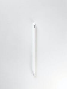 white pen on white surface
