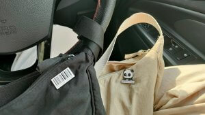 a bag with a panda face on it sitting in a car